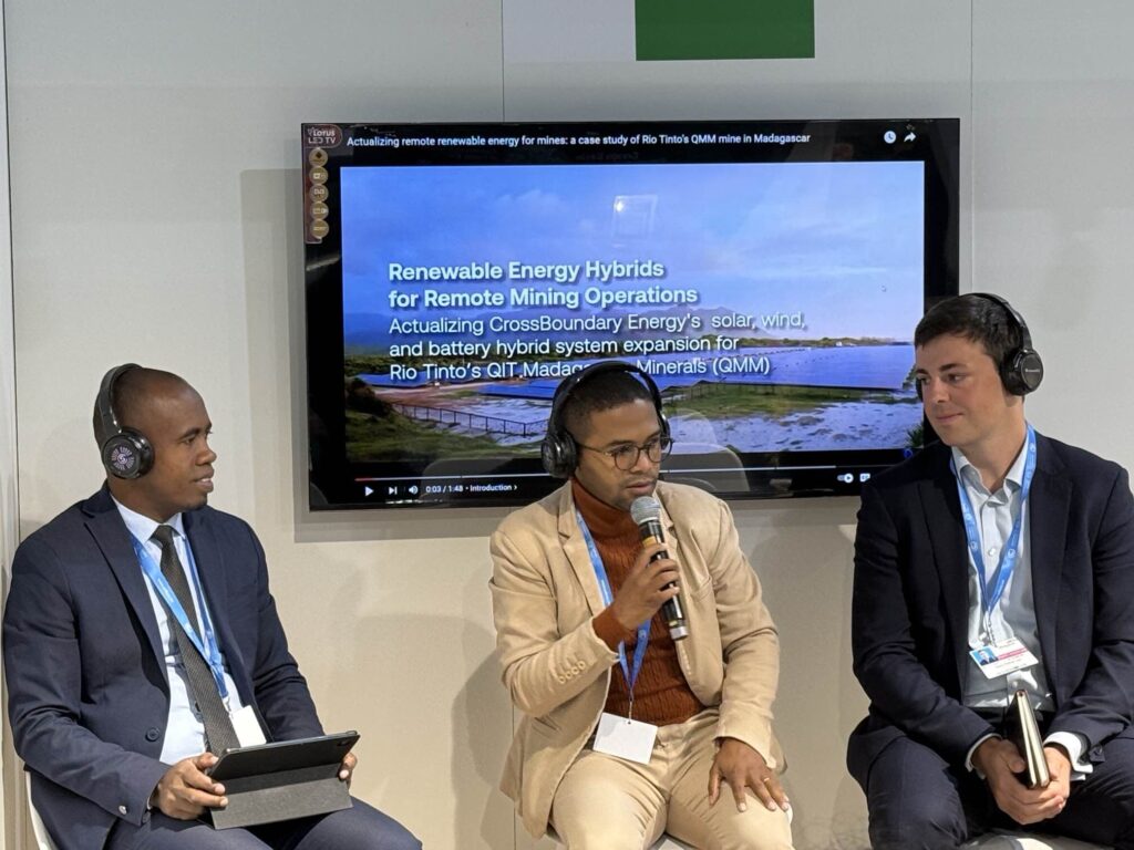 Three men on a panel at the Malagasy Pavilion at COP29