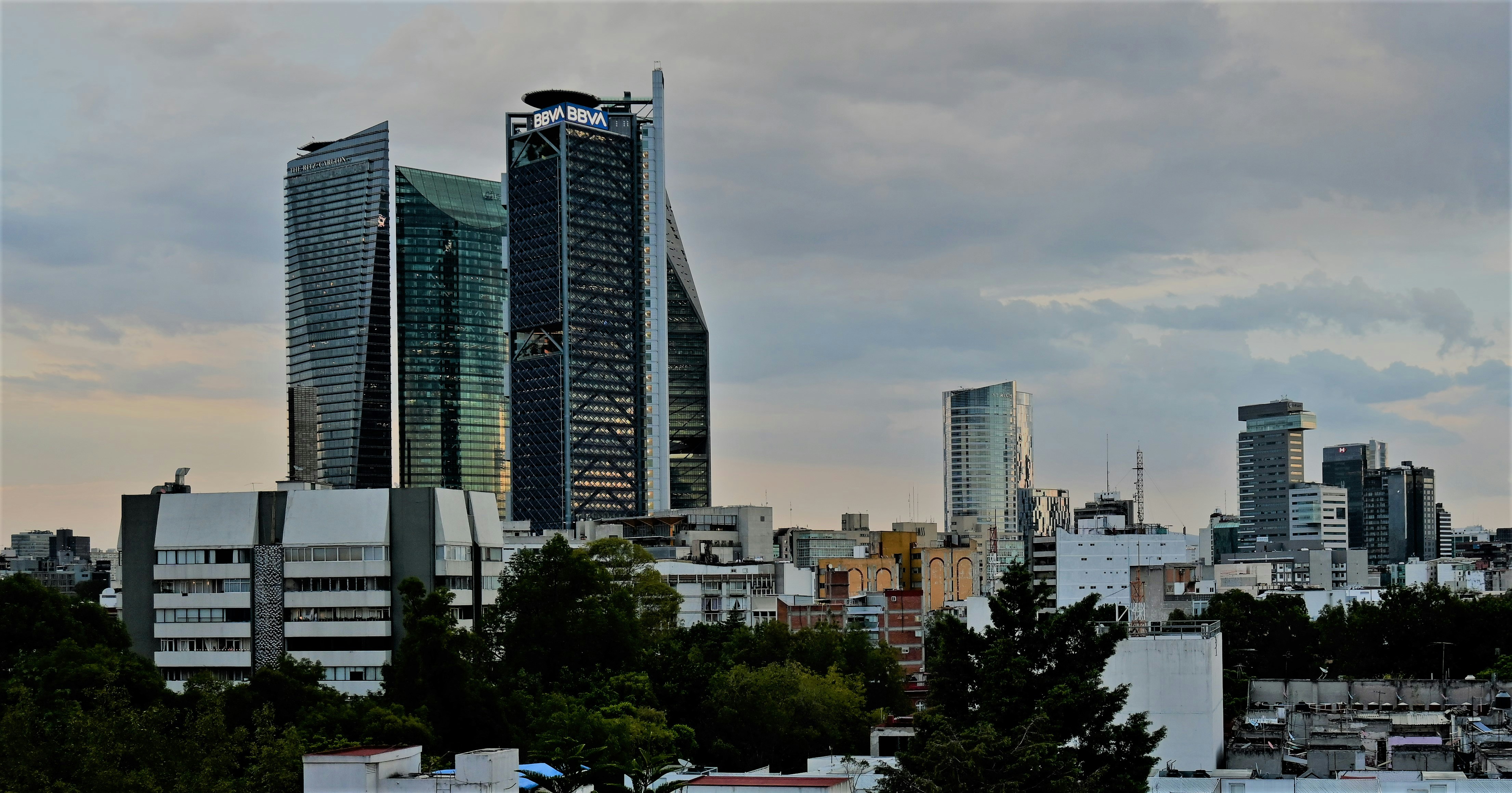 Rooftops of Mexico City's Colonia Condesa looking over towards the towers on Paseo de la Reforma.